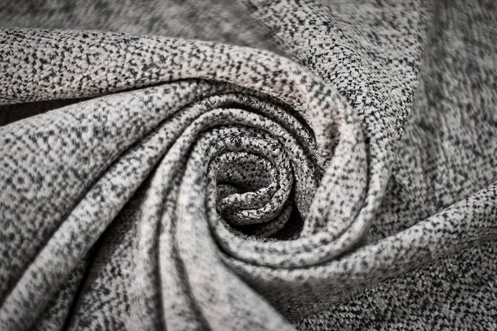 grey-and-black-textile-3099298 Detailed close-up of a gray fabric spiral showcasing intricate textures and patterns.
